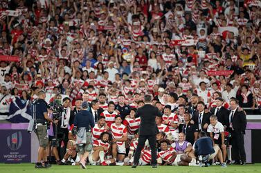 Japan players celebrate their win over Scotland in the Rugby World Cup in Yokohama. Getty