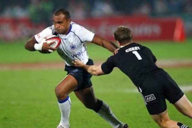 Smaoa's Faalemiga Selesele makes a run in final of the Emirates International Trophy at the Dubai Rugby Sevens.. Jake Badger for The National