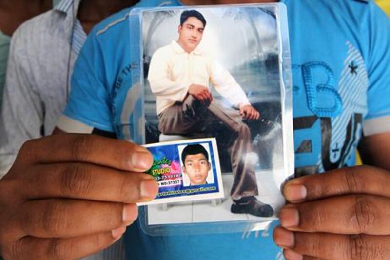 Khurshid Alam (around 26 years old big photo ) and his younger brother Masoud Alam (smaller photo) who died in the Al Ain crash. Pawan Singh / The National