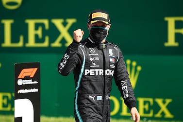 Formula One F1 - Austrian Grand Prix - Red Bull Ring, Spielberg, Styria, Austria - July 5, 2020 Mercedes' Valtteri Bottas wearing a protective face mask celebrates after winning the race, as F1 resumes following the outbreak of the coronavirus disease (COVID-19) Mark Thompson/Pool via REUTERS