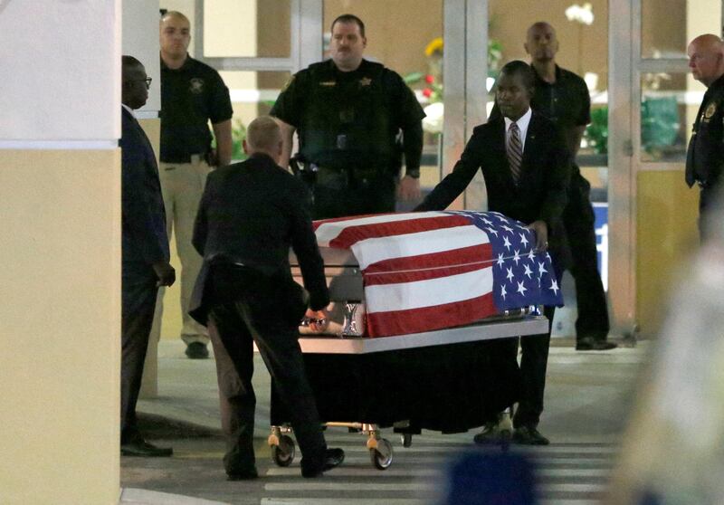 Following a public viewing, the coffin of U.S. Army Sergeant La David Johnson, who was among four special forces soldiers killed in Niger, is taken from Christ The Rock Church in Cooper City, Florida, October 20, 2017.  REUTERS/Joe Skipper
