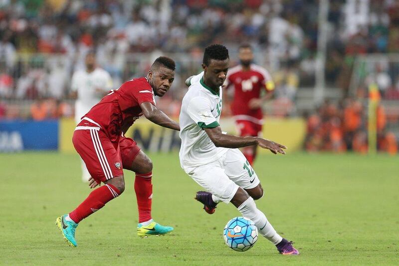 Hassan Fallatah of Saudi Arabia dribbles past Ismail Al Hammadi of the UAE during their World Cup qualifying match on Tuesday night in Jeddah. Photo Courtesy / Aletihad / October 11, 2016