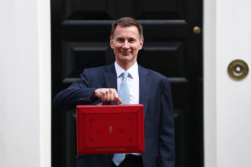Jeremy Hunt, Chancellor of the Exchequer, leaves No 11 Downing Street to deliver his budget to Parliament in London. Getty Images