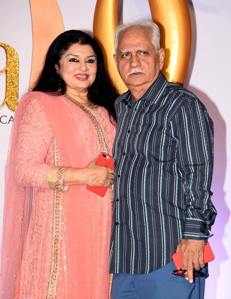 Bollywood director Ramesh Sippy (R) and his wife Kiran Juneja arrive for the IIFA Rocks of the 20th International Indian Film Academy (IIFA) Awards at NSCI Dome in Mumbai on September 16, 2019