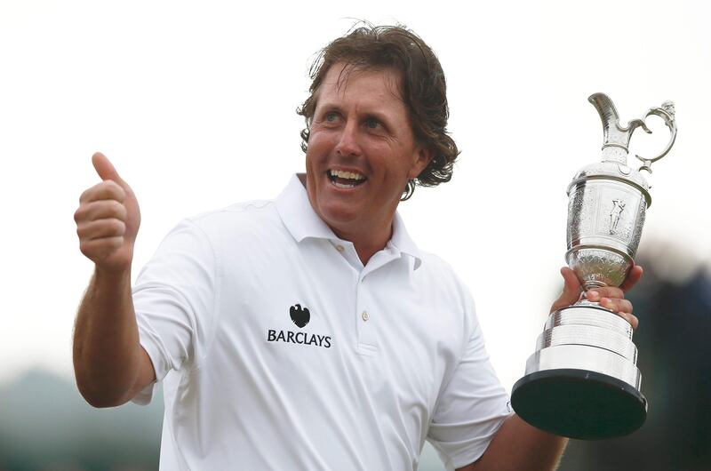 Phil Mickelson of the United States gestures as he holds up the Claret Jug trophy after winning the British Open Golf Championship at Muirfield, Scotland, Sunday July 21, 2013.  (AP Photo/Matt Dunham) *** Local Caption ***  British Open Golf.JPEG-0fe5c.jpg