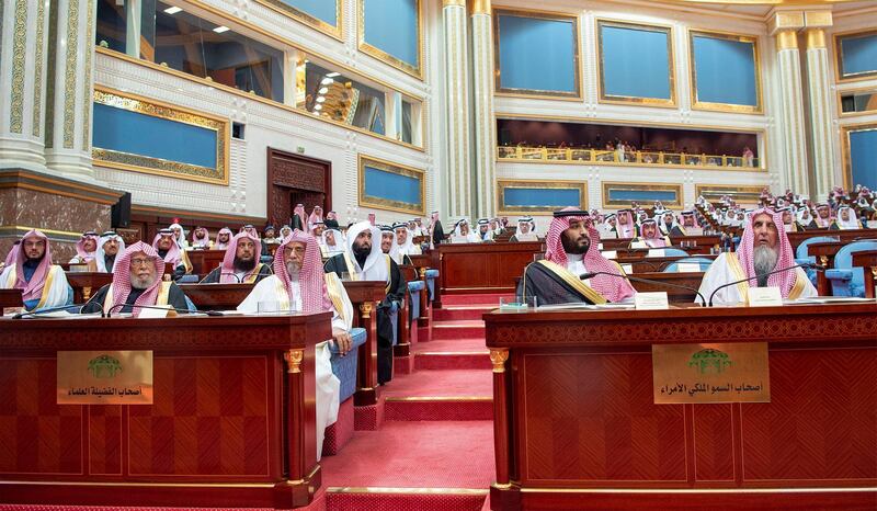 Prince Mohammed bin Salman sits next to Saudi Arabia's Grand Mufti Sheikh Abdulaziz Al al-Sheikh as they attend a session of the Shura Council. Saudi Royal Court / Reuters