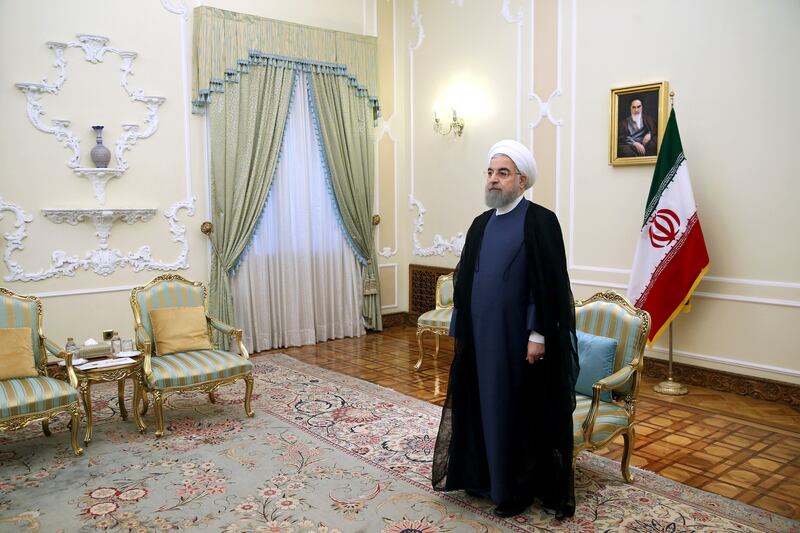 Iranian President Hassan Rouhani waits to welcome European Union foreign policy chief Federica Mogherini at the presidenial office in Tehran, Iran, Saturday, Aug. 5, 2017. According to IRNA official news agency, 100 foreign delegations including seven presidents and 18 parliament speakers are set to attend Rouhani's inauguration of his second term as president. (AP Photo/Ebrahim Noroozi)