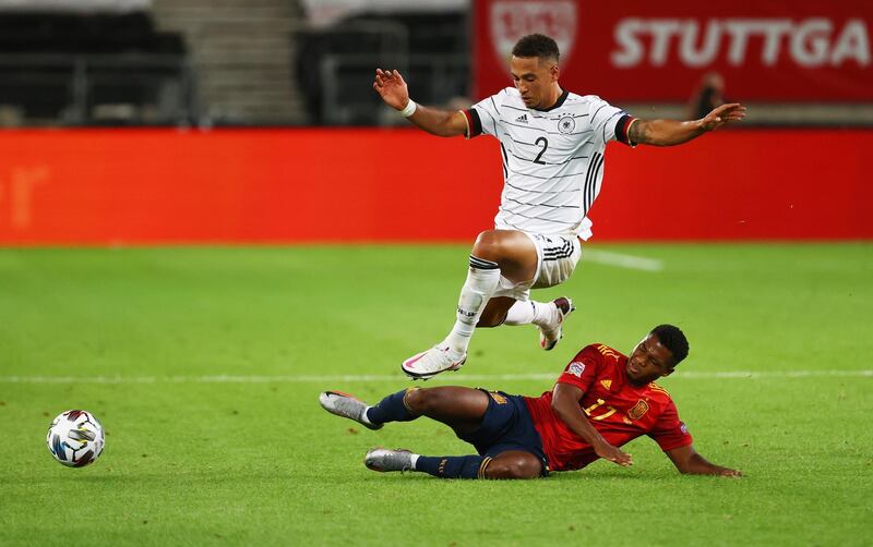 Germany's Thilo Kehrer rides a challenge from Spain's Ansu Fati. Reuters