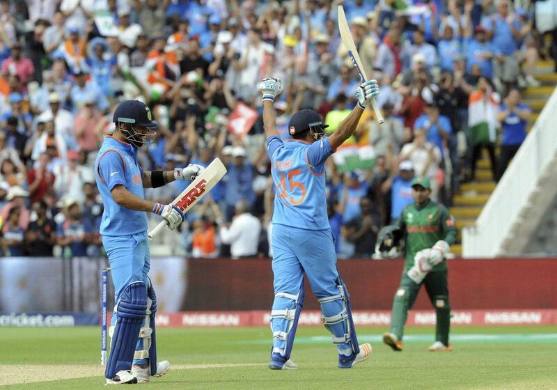 India's Rohit Sharma, centre, celebrates after reaching a century during the Champions Trophy semi-final match between Bangladesh and India at Edgbaston in Birmingham, England, Thursday, June 15, 2017. Rui Vieira / AP Photo