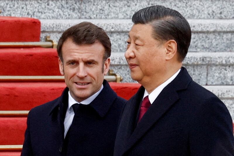 President Emmanuel Macron and President Xi Jinping in Beijing, China in 2023. Mr Xi will visit France this week. Reuters