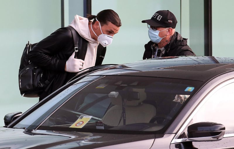 Zlatan Ibrahimovic, wearing a protective face mask, arrives at Malpensa airport in Milan earlier this month. EPA