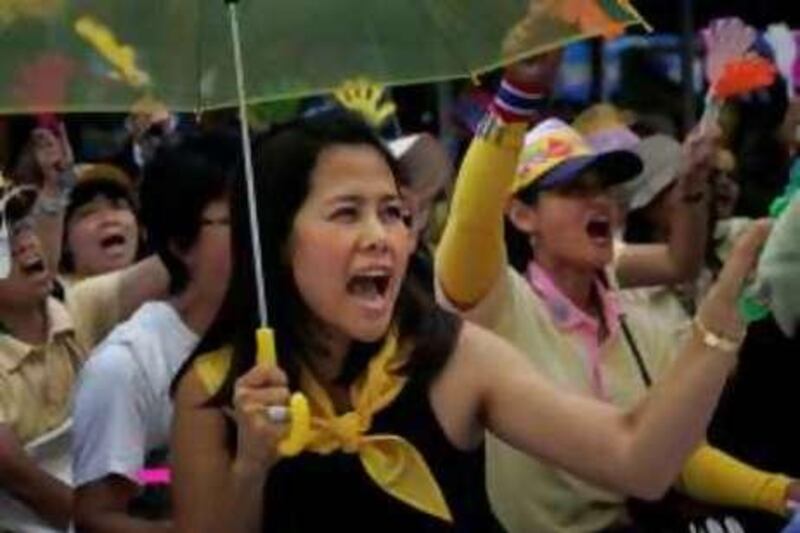 Anti-government protesters chant slogans during a rally on the lawn of the Government House, Wednesday, Sept. 3, 2008, in Bangkok, Thailand. A strike by anti-government labor unions fizzled out Wednesday, but protesters demanding Prime Minister Samak Sundaravej's resignation refused to lift a weeklong siege of his office, ignoring an emergency decree that has hardened Thailand's political deadlock. (AP Photo/Wally Santana) *** Local Caption ***  XWS104_APTOPIX_Thailand_Political_Unrest.jpg