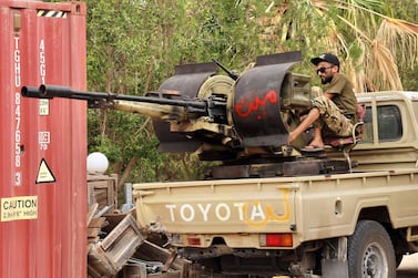 Fighters loyal to the Libyan Government of National Accord are pictured during clashes with forces loyal to Khalifa Haftar in an area south of the Libyan capital Tripoli . AFP  