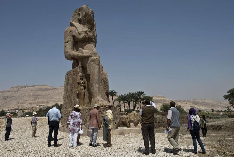 One of the “new” statues — its body weighing 250 tonnes — again depicts the pharaoh seated, hands resting on his knees. It is 11.5 metres (38 feet) tall, with a base 1.5 metres high and 3.6 metres wide. Archaeologists said with its now missing double crown, the original statue would have reached a height of 13.5 metres and weighed 450 tonnes.