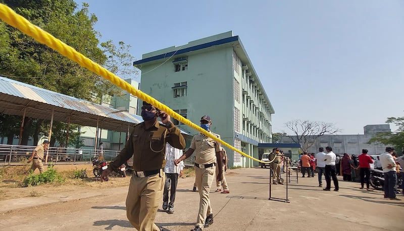 Policemen walk outside the Bhandara District General Hospital in the aftermath of a fire. EPA
