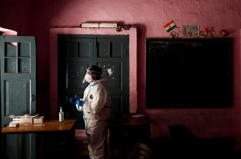 A medical worker waits for the next person to get tested at a school turned into a centre to conduct tests for coronavirus in New Delhi, India. Reuters