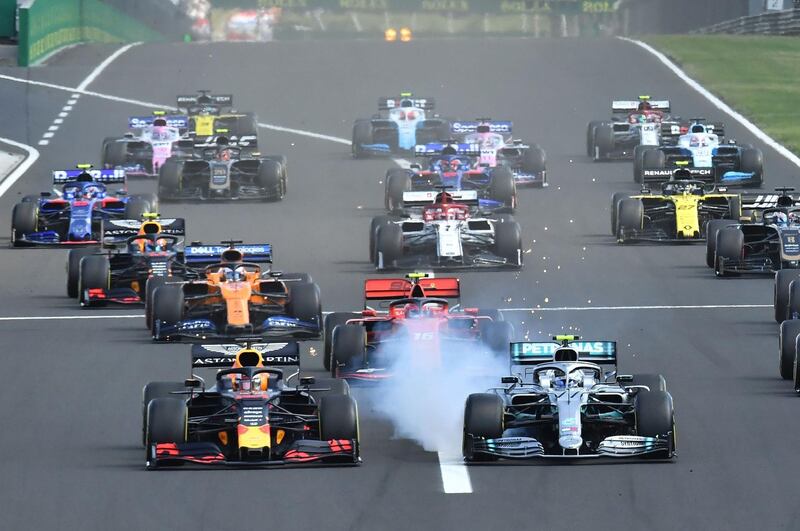 Verstappen, left, leads at the start as Bottas locks up. AFP