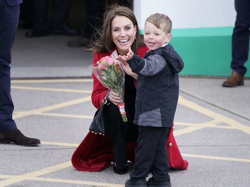 Kate speaks with four-year-old Theo Crompton. PA
