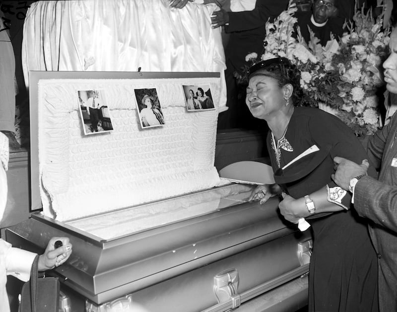 Mamie Till Mobley weeps at her son's funeral on September 6, 1955, in Chicago, Illinois. The mother of Emmett Till insisted that her son's body be displayed in an open casket forcing the nation to see the brutality directed at blacks in the south at the time.  Chicago Sun-Times / AP