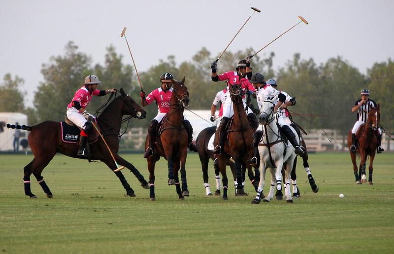 Polo exhibition match between Abu Dhabi Commercial Bank (pink) and St Regis (white) during last year’s Pink Polo event to raise awareness about breast cancer. Pawan Singh / The National