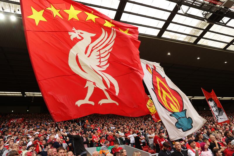 Liverpool fans show their support prior at Anfield. Getty