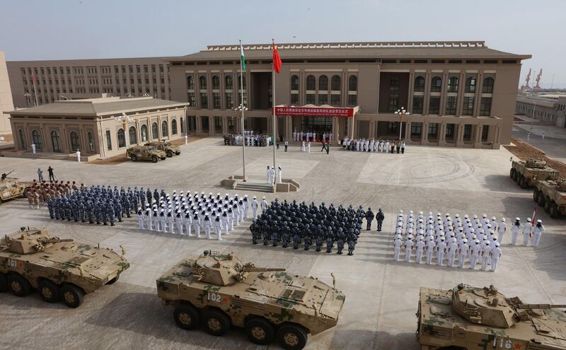 This photo taken on August 1, 2017 shows Chinese People's Liberation Army personnel attending the opening ceremony of China's new military base in Djibouti. 
China has deployed troops to its first overseas naval base in Djibouti, a major step forward for the country's expansion of its military presence abroad. / AFP PHOTO / STR / China OUT