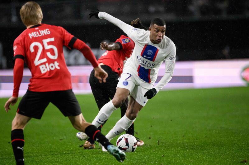 Paris Saint-Germain's French forward Kylian Mbappe runs  with the ball. AFP