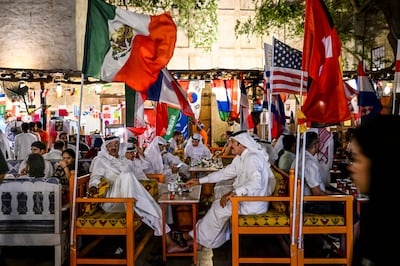 People drink coffee at the Souq Waqif marketplace in Doha ahead of the Qatar 2022 World Cup. AFP