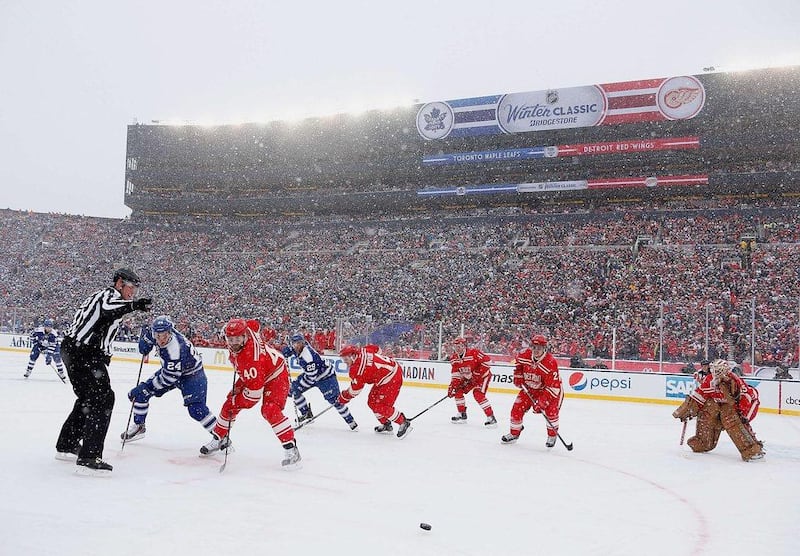 Henrik Zetterberg #40 of the Detroit Red Wings and Nazem Kadri #43 of the Toronto Maple Leafs face off during the NHL Winter Classic at Michigan Stadium on Wednesday in Ann Arbor, Michigan. Toronto won the game 3-2 in a shootout. Gregory Shamus/Getty Images