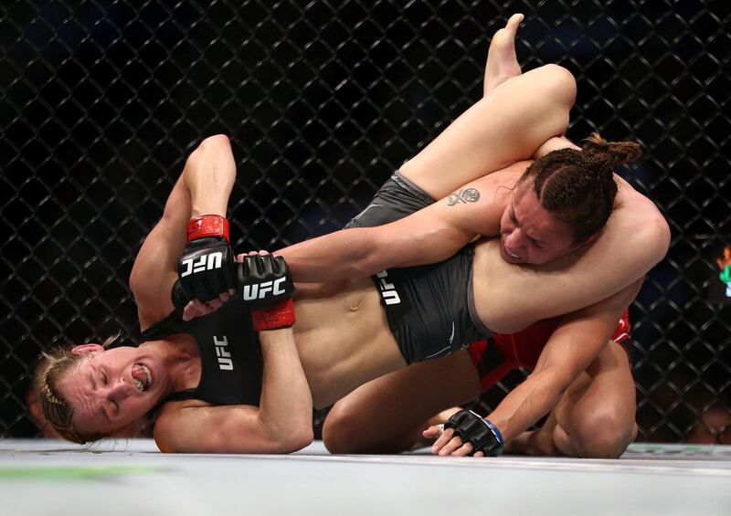 Andrea Lee applies a hold during her victory against Antonina Shevchenko during UFC 262 at Toyota Centre in Houston, Texas on Saturday, May 15. USA TODAY Sports