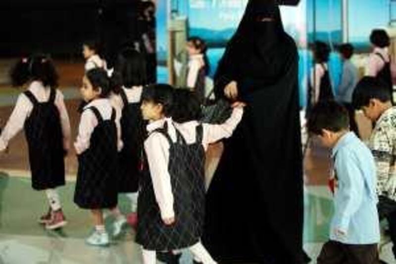 A Saudi teacher leads students as they visit a shopping mall in the Saudi capital of Riyadh on March 16, 2008. AFP PHOTO/HASSAN AMMAR