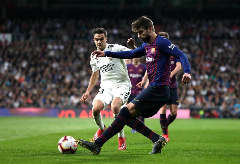 Sergio Reguilon of Real Madrid closes down Gerard Pique of Barcelona. Getty