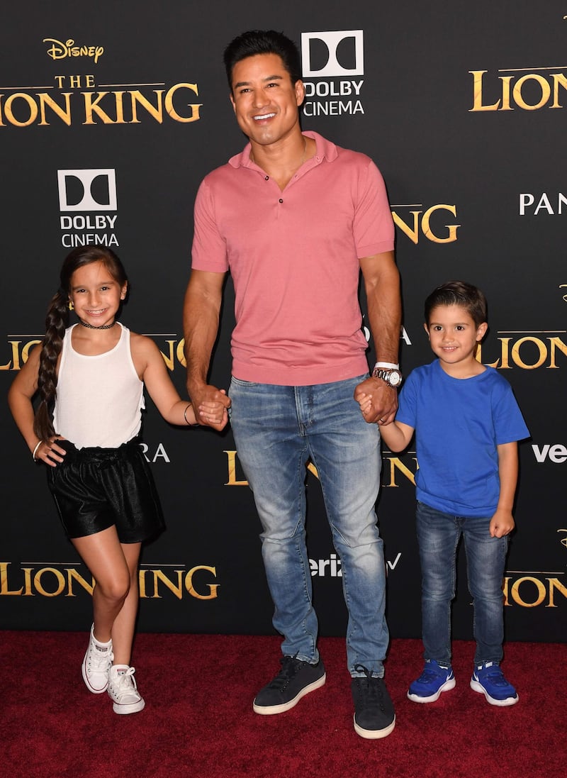 Mario Lopez with his daughter Gia and son Dominic arrive for the world premiere of Disney's 'The Lion King' at the Dolby Theatre on July 9, 2019. AFP
