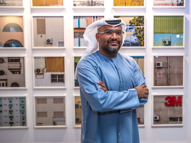 Emirati photographer Hussain Al Moosawi during the launch of the exhibition. Victor Besa / The National