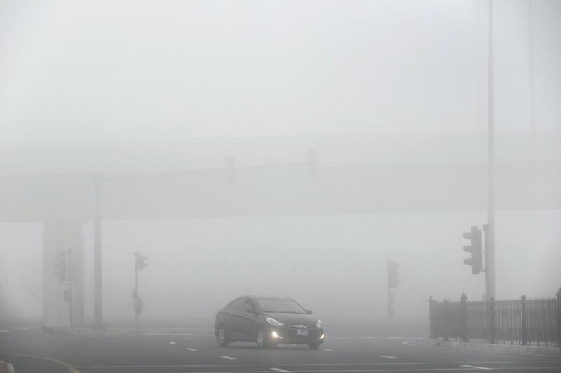 DUBAI, UNITED ARAB EMIRATES. 24 DECEMBER 2017. Heavy morning fog envelopes the city. Early morning traffic in the fog around The Springs. (Photo: Antonie Robertson/The National) Journalist: None. Section: National.