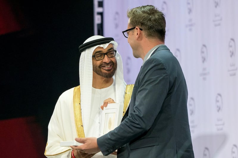 ABU DHABI, UNITED ARAB EMIRATES - January 14, 2019: HH Sheikh Mohamed bin Zayed Al Nahyan, Crown Prince of Abu Dhabi and Deputy Supreme Commander of the UAE Armed Forces (L), presents an award to a representative from 'Sanku', the winners of the Zayed Sustainability Prize for Food.



( Rashed Al Mansoori / Ministry of Presidential Affairs )
---