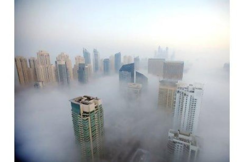 Morning fog descends over Dubai Marina. Researchers are looking into fog farming as a means to providing usable water.
