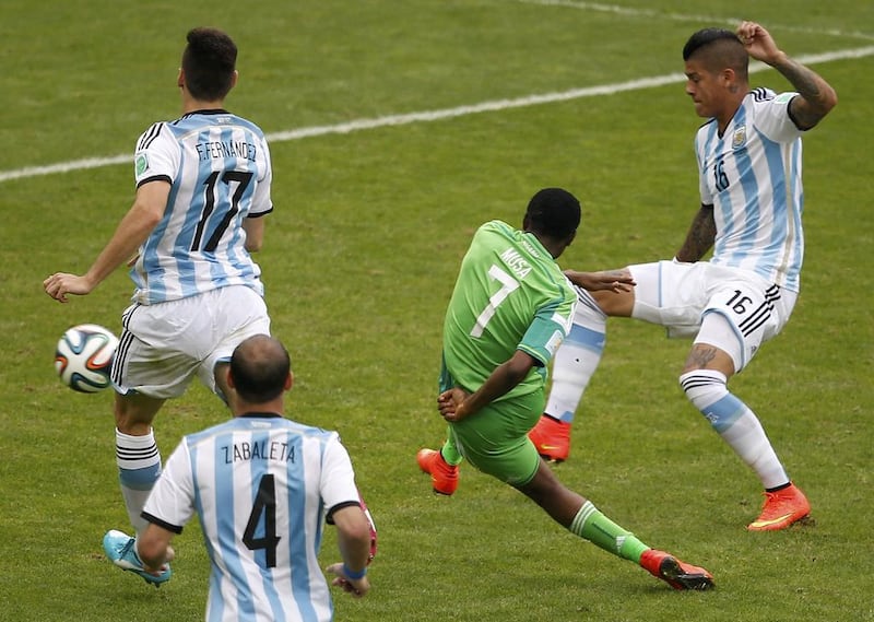Nigeria's Ahmed Musa shoots and scores his second goal against Argentina to equalise again at 2-2 on Wednesday in their match at the 2014 World Cup. Marko Djurica / Reuters