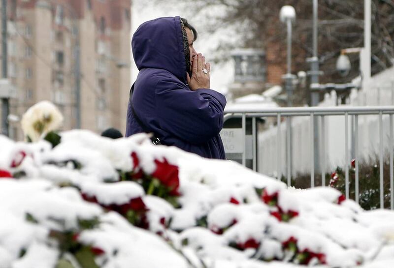 A woman grieves at a memorial in front of the French embassy in Moscow to express sympathy and solidarity to French people and victims of the attacks in Paris, Moscow, Russia, 16 November 2015. Eight assailants were killed, seven when they detonated their explosive belts, and one when he was shot by officers, police said. French President Francois Hollande says that the attacks in Paris were an ‘act of war’ carried out by ISIL. Sergei Chirikov / EPA