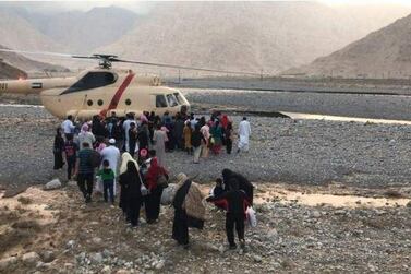 Stranded people board a police helicopter in the Jebel Jais area. 