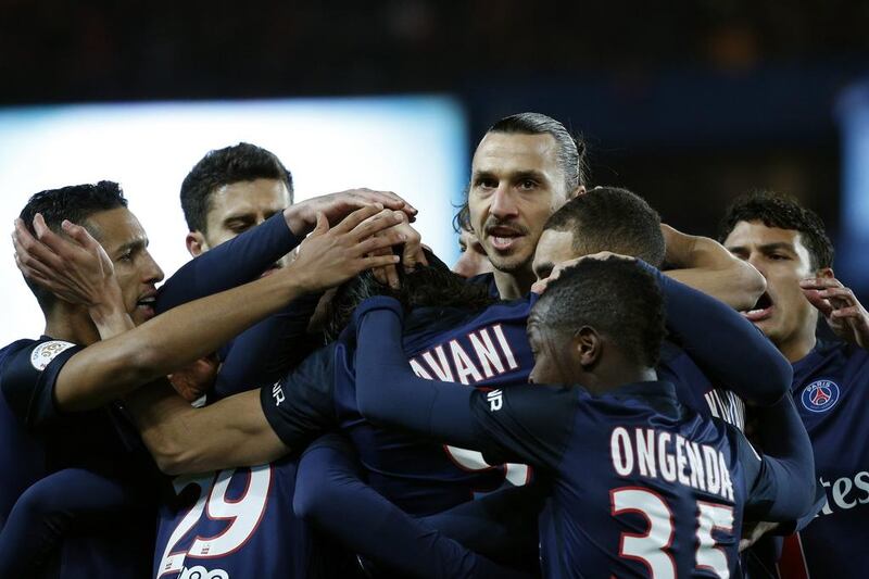 Zlatan Ibrahimovic (C) of Paris Saint Germain reacts with team-mates after Edinson Cavani (unseen) scored the 1-0 lead during the French Ligue 1 soccer match between Paris Saint-Germain (PSG) and FC Lorient at the Parc des Princes stadium in Paris, France, 03 February 2016. EPA/YOAN VALAT 