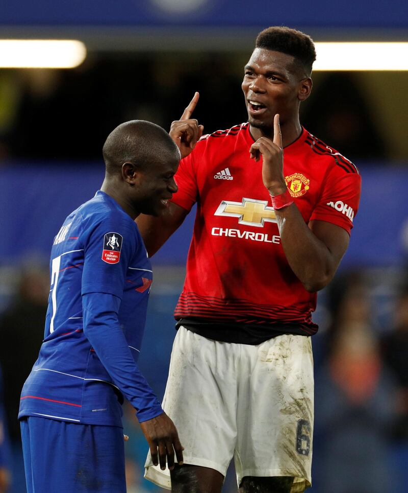 Manchester United's Paul Pogba gestures alongside Chelsea's N'Golo Kante at the end of the match. Reuters