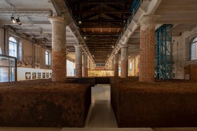 Delcy Morelos's 'Earthly Paradise' fills the cavernous Arsenale with packed, redolent earth at the Venice Biennale. Photo: Roberto Marossi