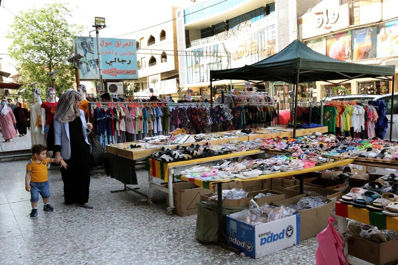Iraqis shop for Eid al-Fitr at a market in Baghdad's Karada district, Iraq.  EPA
