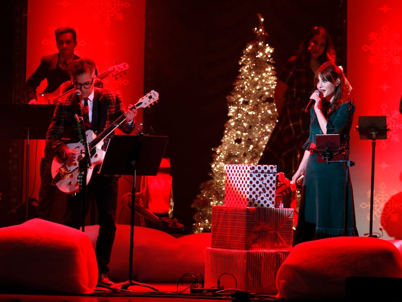 M Ward and Zooey Deschanel of She & Him perform at the Ryman Auditorium on December 8, 2021 in Nashville, Tennessee. AFP