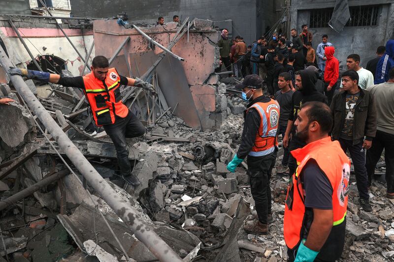 Palestinian medics search for survivors in the rubble following Israeli bombardment of Rafah in the southern Gaza Strip as fighting resumed on Friday. AFP