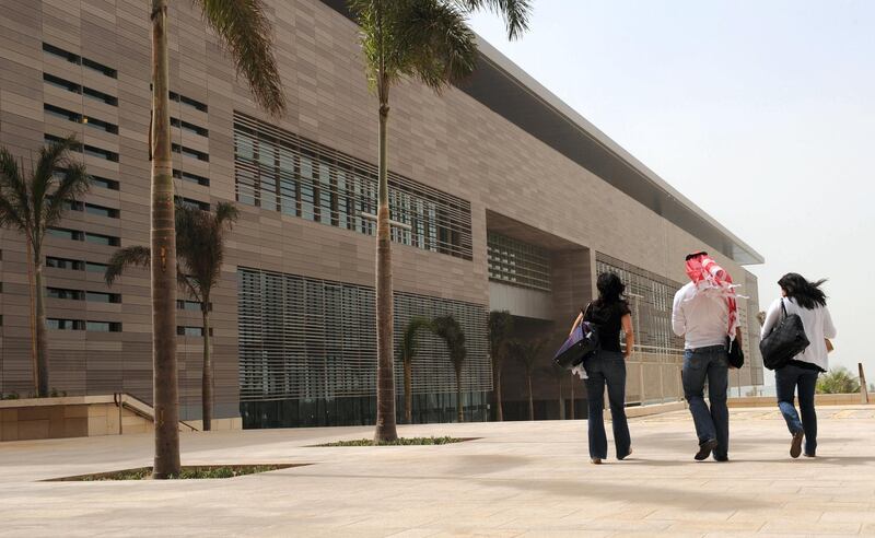 A man walks with two unveiled women at the campus of the King Abdullah University of Science and Technology (KAUST) on October 13, 2009, in Thuwal, 80 kilometers north of Jeddah. AFP PHOTO/OMAR SALEM (Photo by Omar Salem / AFP)