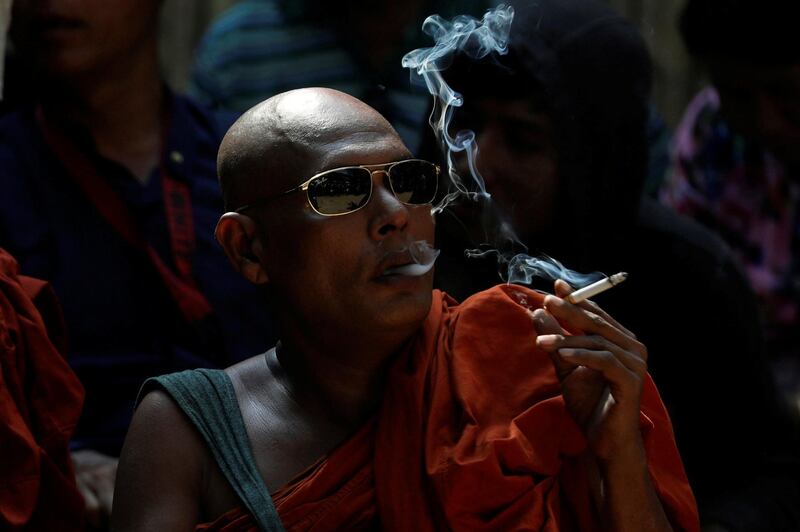 A Buddhist monk waits for the final verdict for Muslim lawyer Ko Ni's murder case at Insein court in Yangon, Myanmar. Reuters