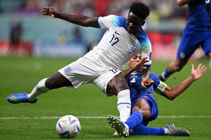 England forward Bukayo Saka is challenged by USA's Tyler Adams. AFP
