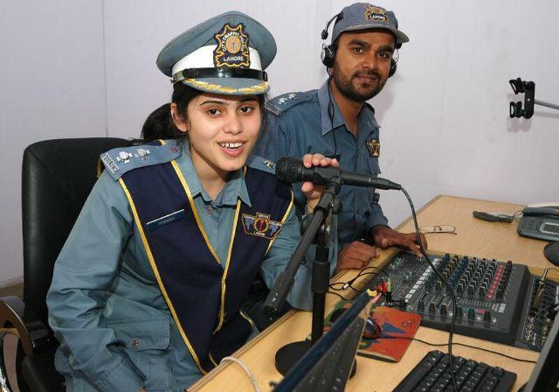 From left: Sumaira Shaukat and Suhail Arshad of the Pakistan Traffic Police's FM Radio project during their test transmission.